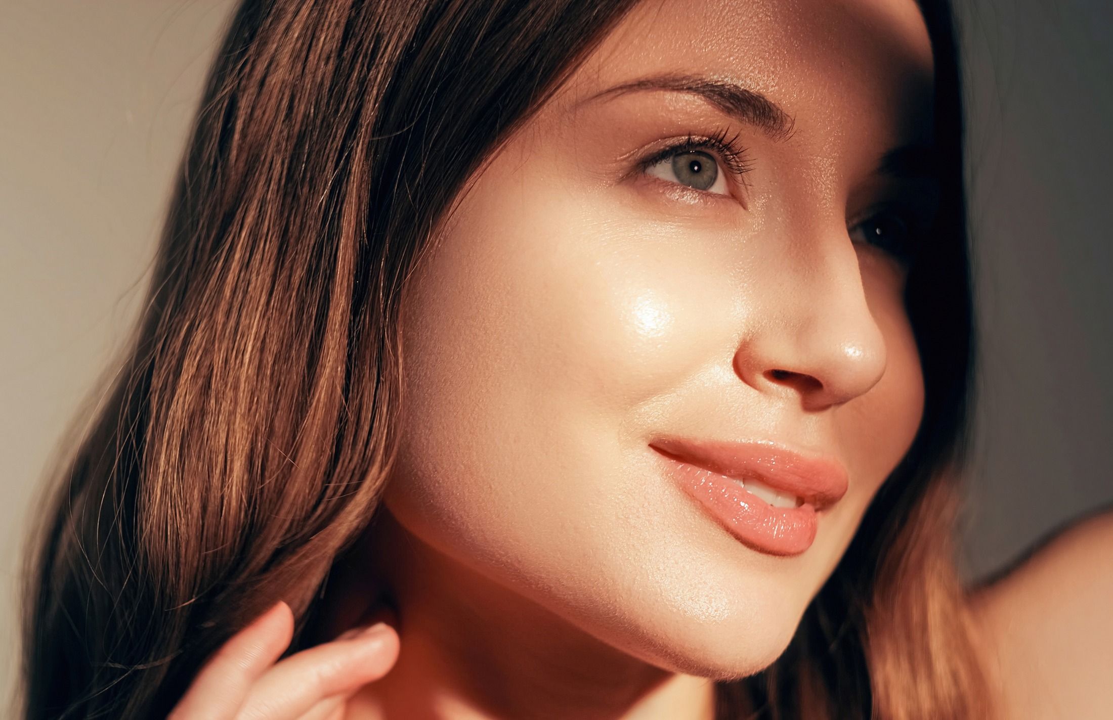 Close-up of a woman's radiant face and smile