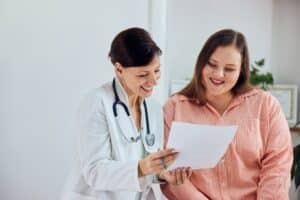 Plus-sized woman having a consultation with her doctor about a sustainable medical weight loss plan